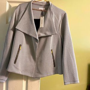 Calvin Klein Blazer. Tag is still attached. Dress it with slacks or jeans.